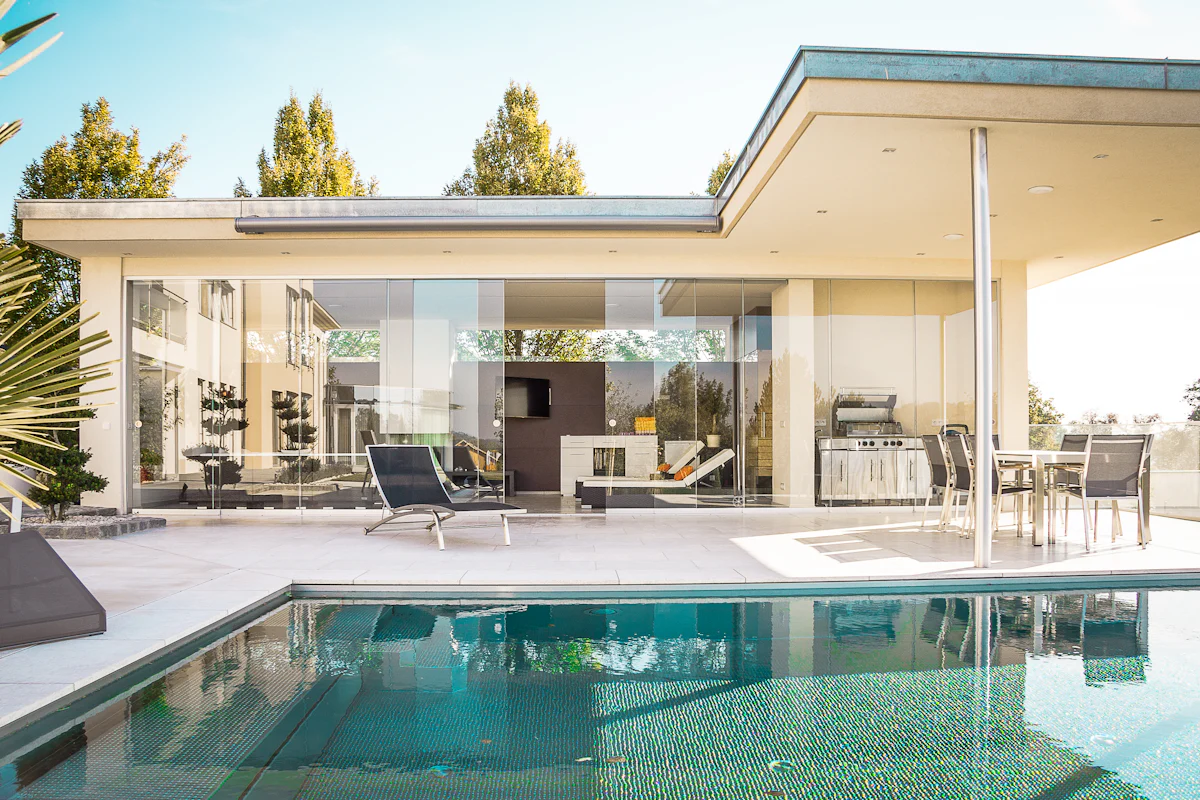 Residential pool beside an outdoor living area